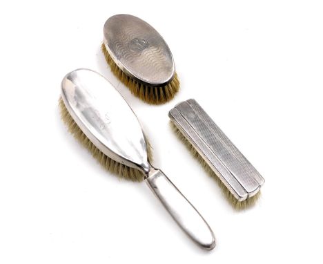 An Edward VII silver backed hairbrush, engraved Lou, Birmingham 1908, Elizabeth II silver backed clothes brush, with engine t