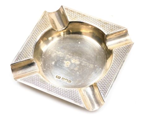 An Elizabeth II silver ashtray, with engine turned decoration, engraved centrally "The Masters" 1963, Sheffield 1962, 2.54oz.