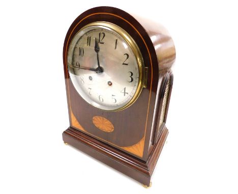An Edwardian mahogany and inlaid mantel clock, circular silver dial bearing Arabic numerals, eight day movement with coil str