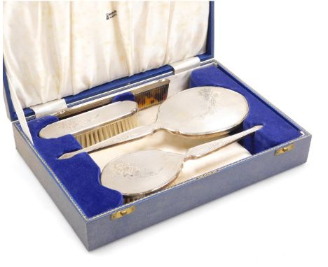 An Elizabeth II four piece silver backed dressing table set, with engine turned and engraved floral decoration, comprising ha