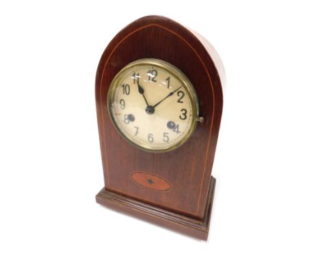An Edwardian mahogany and inlaid mantel clock, circular cream dial bearing Arabic numerals, Kienzle eight day movement with c