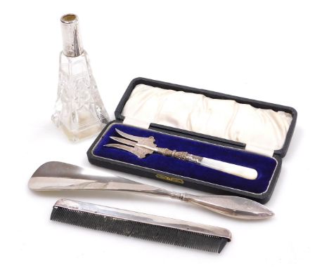 An Edward VII silver handled shoe horn, with engine turned decoration, Birmingham 1908, silver backed comb, Birmingham 1912, 