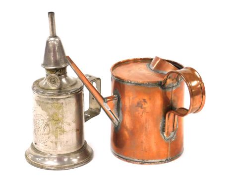 An early 20thC Helix copper oil can, 9034/54, 13.5cm high, together with a Clamfor pigeon oil lamp, 17.5cm high. (2)