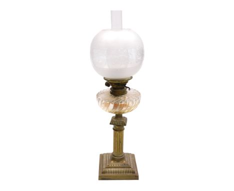 An early 20thC Messenger's number one brass oil lamp, of column form, with a fluted pressed glass reservoir, with chimney and