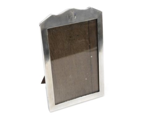 A George V silver strut photograph frame, with engine turned decoration, circular vacant reserve, Birmingham 1918, 22.5cm x 1