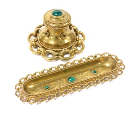 A Victorian brass desk set, inset with malachite cabochons, engraved with foliate decoration, and a cable link border, compri