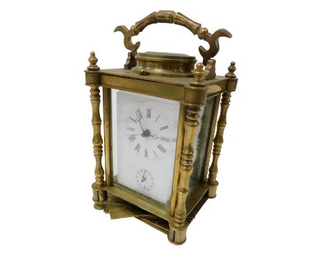 A late Victorian brass cased alarm carriage clock, rectangular white enamel dial bearing Roman numerals, subsidiary alarm dia