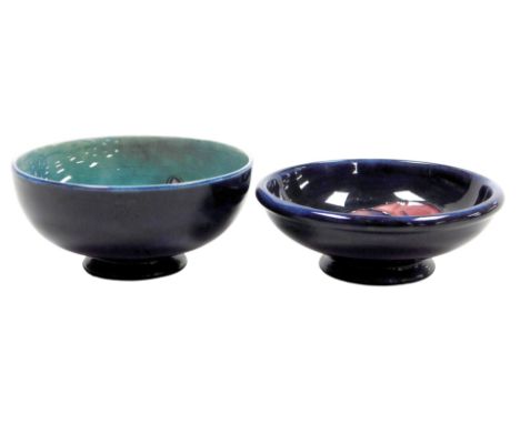 A Moorcroft pottery Columbine pattern bowl, light blue ground, impressed marks, together with a Pansy pattern footed bowl, da