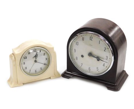An early 20thC Enfield brown bakelite cased mantel clock, circular silver dial bearing Arabic numerals, eight day movement wi