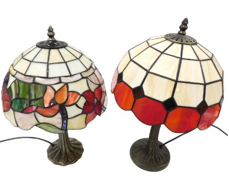 A Tiffany style brass table lamp, of tree form, with a red and white opaline glass shade, 47cm high, and a further Tiffany st