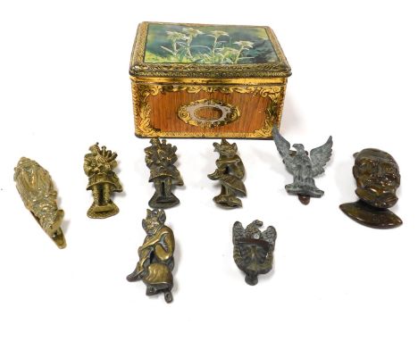 A group of 20thC brass door knockers, including a figural knocker of George V, crinoline lady, two bagpipers, and two pixies.