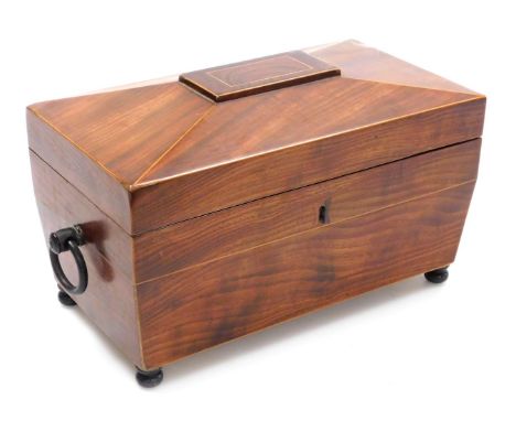 A Regency mahogany and rosewood tea caddy, with boxwood line inlay of sarcophagus form, with twin ring handle, the hinged lid