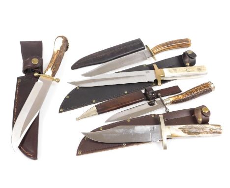 A group of hunting knives, with ceramic or antler handles, with leather sheaths. (5)