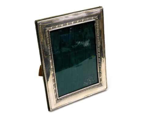 An Elizabeth II silver strut photograph frame, with Celtic knot decoration, London 2001, 22.5cm x 18cm.