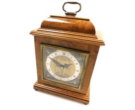 A mid century Elliott walnut cased mantel clock for Pearce and Sons Ltd, Leicester, rectangular brass dial with cherub spandr