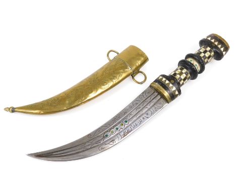 A 20thC Syrian Magdali dagger with a brass capped and inlaid ebony hilt, curved double edge blade and brass scabbard, 36cm lo