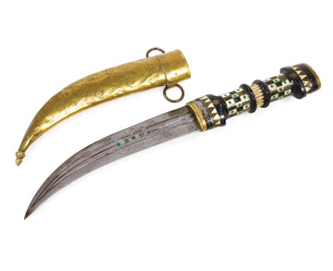 A 20thC Syrian Magdali dagger with a brass capped and inlaid ebony hilt, curved double edge blade and brass scabbard, 38cm lo