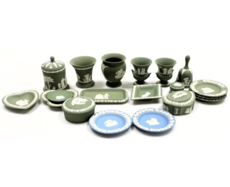 A group of Wedgwood green and light blue Jasper pottery, including vases, ashtrays, dressing table dishes, a bell and a jar a