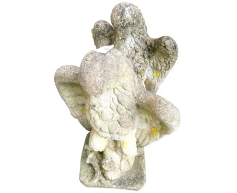 A pair of reconstituted stone gate finials, each modelled in the form of a heraldic eagle, on a square base, 47cm high. 