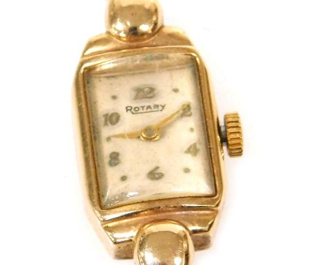 A Rotary lady's 9ct gold cased wristwatch, rectangular cream dial, with Arabic numerals at evens, the case of canted rectangu