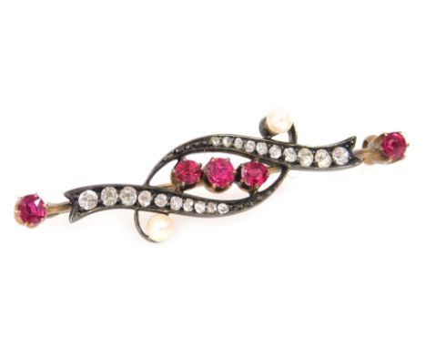 A Victorian ruby, diamond and seed pearl brooch, in a scrolling design, in white and yellow metal, 4.2g all in.