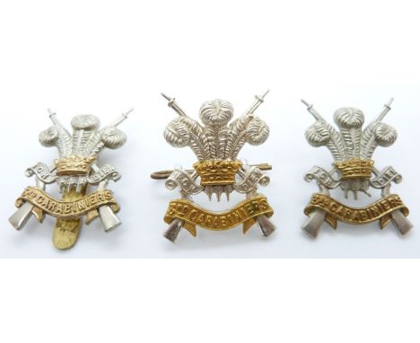 Three British Army 3rd Carabiniers metal cap badges including one officer's