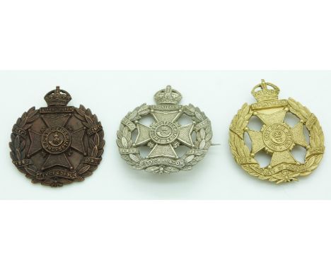 Three British Army 8th City of London Post Office Rifles officer's service dress cap badge, together with two other examples