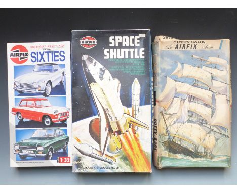 Three Airfix plastic model kits comprising Series 9 Cutty Sark, 1:144 scale Space Shuttle and 1:32 scale British Classic Cars