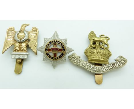 Three&nbsp;British Army Dragoons metal badges including a white metal and enamel example, one by Gaunt
