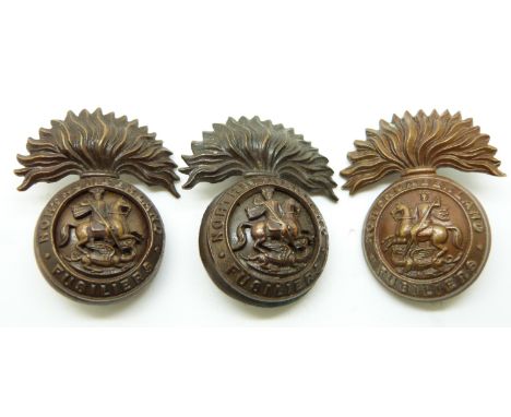 Two British Army Northumberland Fusiliers two piece cap or full size collar badges with flattened plume, by Gaunt of London t