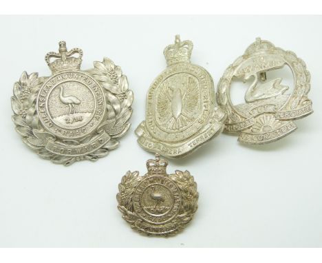 Four Australian Army Mounted Infantry metal badges for the Queensland, South Australian and Western Australia Regiments