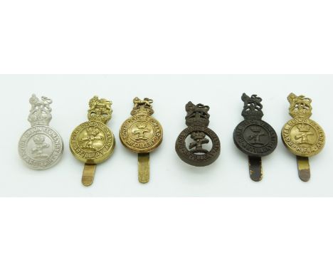 Six British Army Royal Devon Artillery Yeomanry metal cap badges
