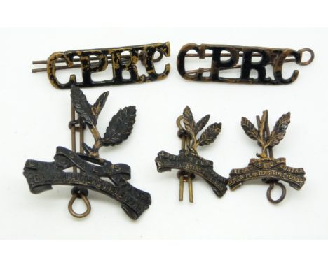 British Army Ceylon Planters Rifle Corps metal badge set comprising cap badger collar badges and shoulder titles