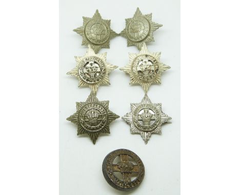 Seven British Army 4th/7th Dragoon Guards metal collar badges including a silver voided example.&nbsp;&nbsp;