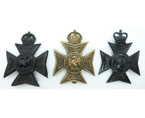 Three British Army Buckinghamshire Battalion metal hat badges including an officer's example