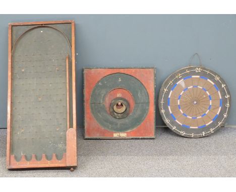 Three vintage bar/ pub games comprising a darts board, bagatelle game and Burdock's Patent Table Quoits board with hoops.&nbs