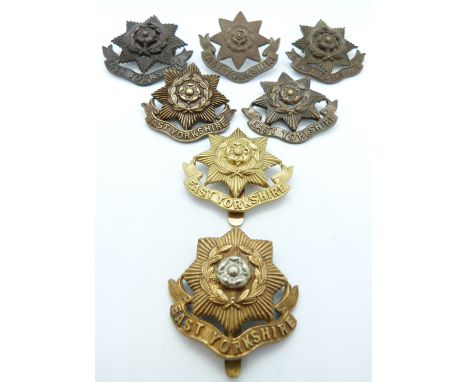 Seven British Army East Yorkshire Regiment metal hat badges