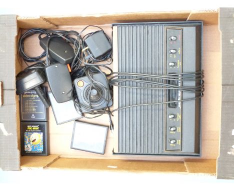 Atari 2600 Woody game console with four games, joysticks etc