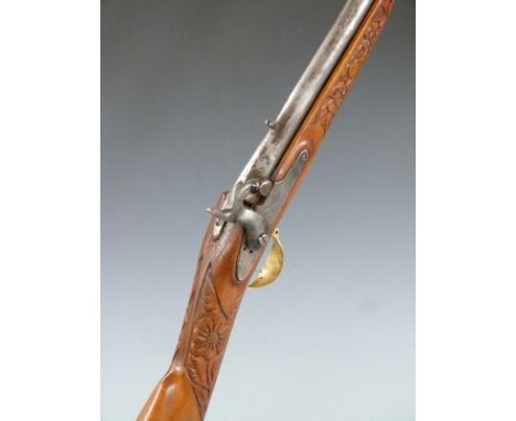 Enfield pattern percussion hammer action gun with engraved eagles crest to the lock, deeply carved wrist and forend, brass tr