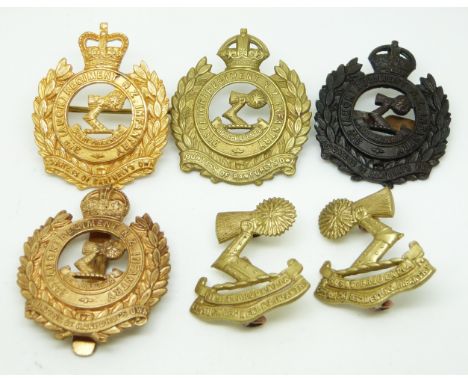 Four New Zealand Army 3rd Auckland Regiment Countess of Ranfurly's Own metal cap badges together with a pair of collar badges