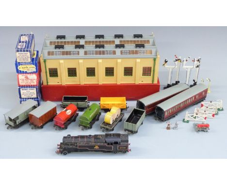 A collection of Hornby Dublo 00 gauge locomotives, coaches, wagons, tankers, vans and accessories including a 2-Road Engine S