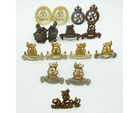 Fifteen British Army support arms metal collar badges for the Pay Corps, Accountants and National Defence Company, some stamp