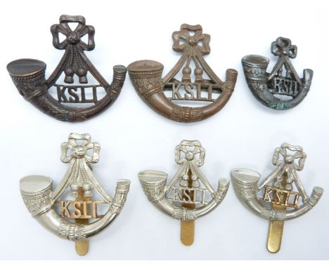 Six British Army King's Shropshire Light Infantry Regiment metal badges