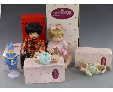 Five Ashton-Drake dolls Cute As A Button, Chen and three others, all in original boxes.&nbsp;