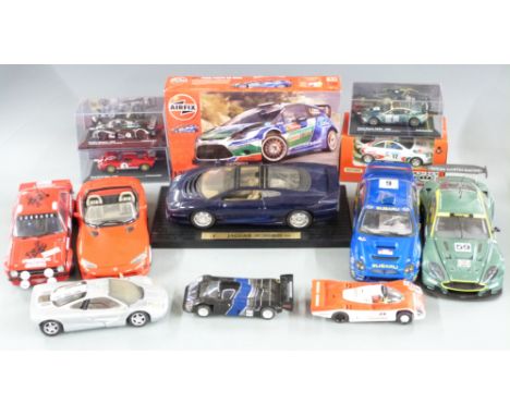 Nine diecast model vehicles including Le Mans racing cars, Dodge Viper, Aston Martin etc, some in original boxes together wit