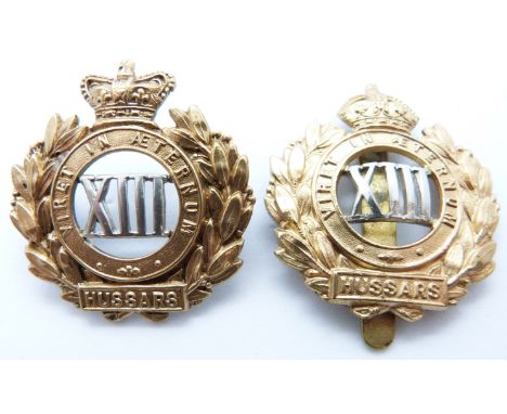 Two British Army 13th Hussars metal cap badges, one with Victoria Crown example
