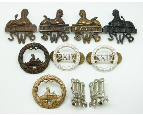 Eight British Army South Wales Borderers metal collar badges together with a pair for the Welsh Brigade.