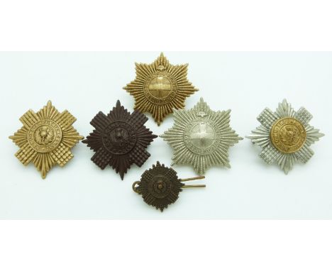 Six British Army Coldstream Guards and Scots Guards metal hat badges