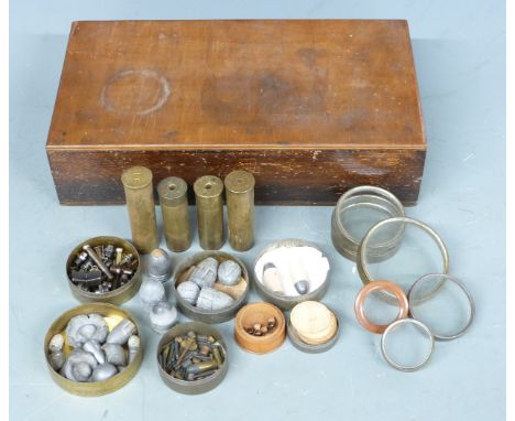 Four Eley-Kynoch 10 bore brass rifle cartridge cases together with associated bullet and various gun accessories including ni