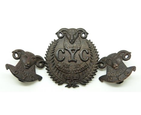 New Zealand Army 1st Canterbury Yeomanry Cavalry officer's metal cap badge with Gaunt makers to reverse and two collar badges